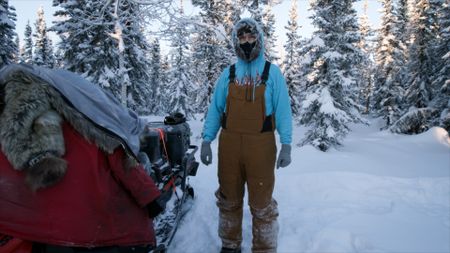 Ricko DeWilde sets wolf snares in below freezing temperatures. (BBC Studios/Ryan Walsh)