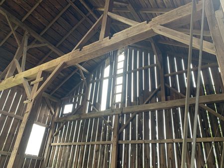 Wooden beams hold up an old barn in Lake, MI. (National Geographic)