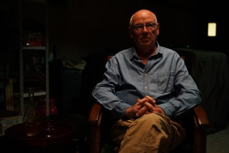 Stéphane Bourgoin is a French author and renowned specialist on serial killers, who since 2019 has been at the center of an internet-led controversy spearheaded by a group of anonymous true crime fans.  Here, Bourgoin poses for a portrait during the production of "Killer Lies: Chasing a True Crime Con Man," a documentary series about obsession and deception, following the unraveling of Stephane Bourgoin’s career as a best-selling author and serial killer expert. (National Geographic/Ben Selkow)