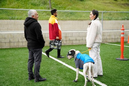 Cesar talks with Adriana as she holds Brunello on leash during the bag exercise. (National Geographic)