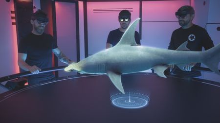 Aldo Kane, Eric Stackpole and Matt Smukall are in the OceanXplorer's Hololab to explore the anatomy of the great hammerhead shark, taking a closer look at its cephalofoil. (National Geographic)