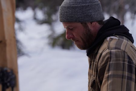 Johnny Rolfe builds ski's to help him make the long journey to fix his broken snowmobile. (BBC Studios Reality Productions/