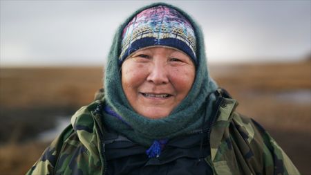 Teresa Pingayak out in the tundra of Western Alaska. (National Geographic)