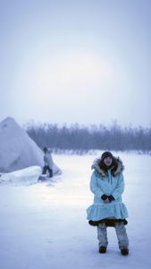 Qutan Hailstone ice fishing with her family. (BBC Studios Reality Productions, LLC/Pedro Delbrey)