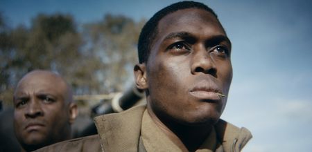Loader Floyd Dade (played by Dalumuzi Moyo) is pictured in close-up in a historic reenactment of the Battle of the Bulge produced for "Erased: WW2's Heroes of Color." 761st Tank Battalion Corporal Floyd Dade served with the 761st Black Panther Tank Battalion in WW2. (National Geographic)