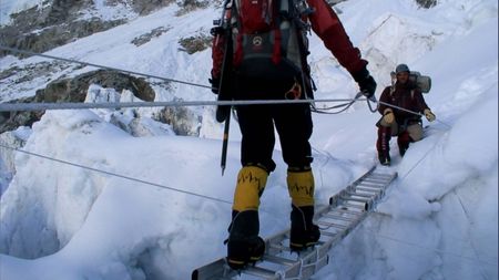 Jimmy Chin uses a ladder as a bridge to cross a cravasse in Mount Everest.  (credit: Jimmy Chin Productions)