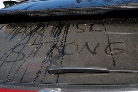 Paradise, CA - A rear window of a vehicle with the words "Paradise Strong" written in the dirt.  (National Geographic/Sarah Soquel Morhaim)