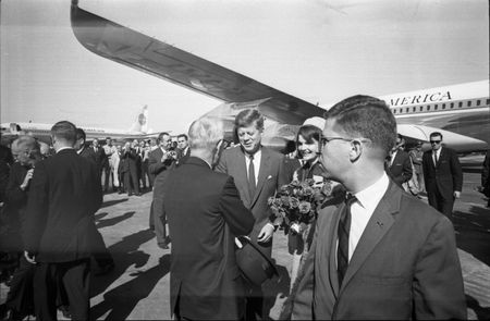 Paul Landis (R) is pictured standing near President John F. Kennedy as he arrives at Love Field in Dallas, Nov. 22, 1963.  (Dallas Times Herald Collection/The Sixth Floor Museum at Dealey Plaza)
