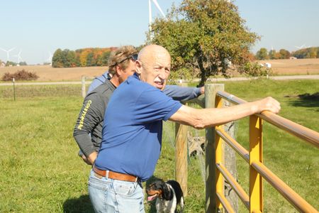 Charles Pol, Ben Reinhold, and Dr. Pol walk the Pol family farm's fence line to inspect what needs to be repaired. (National Geographic)