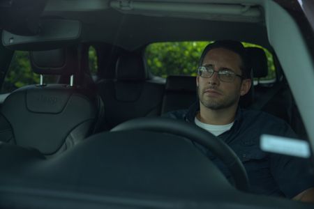 US Marshal Christopher Crotty is pictured in his car in a portrait made during the production of "Cursed Gold: A Shipwreck Scandal." In 1989, maverick scientist Tommy Thompson stuns the world by recovering three tons of gold from a shipwreck deep in the Atlantic Ocean. What follows is a 30-year story of adventure, deception, and personal turmoil, taking him from venerated celebrity to infamous fugitive, and finally a defiant prisoner who refuses to give up his gold. (National Geographic)