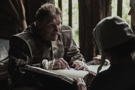 Dietrich Flade pointing at his debt collection book in anger whilst looking at the female citizen in question. (Dash Productions Services LTD/Antoan Ivanov)