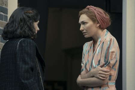 A SMALL LIGHT - Miep, played by Bel Powley, confronts Tess, played by Eleanor Tomlinson, with some troubling news in A SMALL LIGHT. (Credit: National Geographic for Disney/Dusan Martincek)