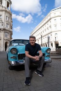 Gordon Ramsay posing with a 1957 Chevy Bel Air. (National Geographic/Justin Mandel)