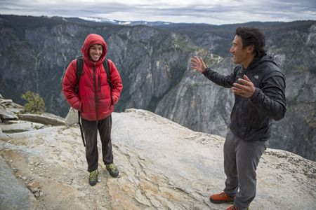 Alex Honnold arrives at the summit of Freerider for another practice day on El Capitan, greeted by Jimmy Chin.  (National Geographic/Samuel Crossley)