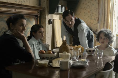 A SMALL LIGHT - The Stoppelman family gathers around the breakfast table in A SMALL LIGHT. (From left: Liza Sadovy as Mrs. Stoppelman, Audrey Kattan as Liddy Cohen, Sebastian Armesto as Max Stoppelman, and George Cobell as Alfred Cohen). (Credit: National Geographic for Disney/Dusan Martincek)