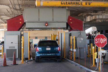 A traveler's vehicle is passing under the Z-Portal X-ray at the El Paso border in order to detect hidden contraband. (National Geographic)