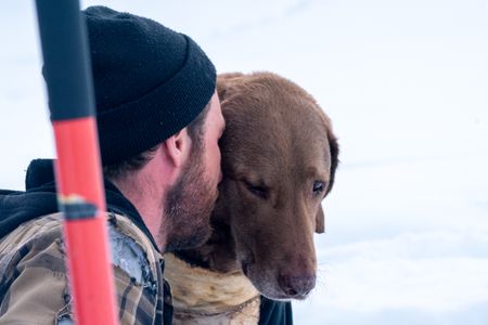 Johnny Rolfe and his dog Java collect ice glacial water. (BBC Studios Reality Production/Patrick Henderson)