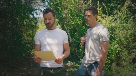 Justin Theroux and Antoni Porowski read a document related to Justin's ancestors' past. (National Geographic)