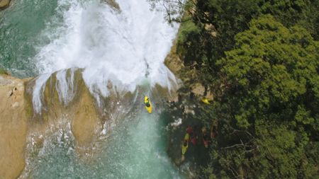 Gerd Serrasolses and his team begin kayaking down a waterfall.  (mandatory photo credit: Rush Sturges / River Roots Productions)