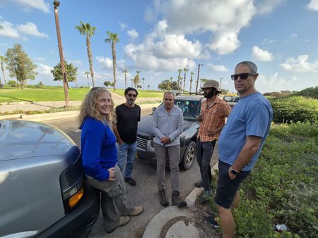 In this behind-the-scenes photo, Beverly Goodman and Jeremy Gabriel are pictured outdoors with Israeli film crew members Ronen Mayo, Doron Peled and Elad Goldberg in Caesarea, Israel. (Windfall Films)