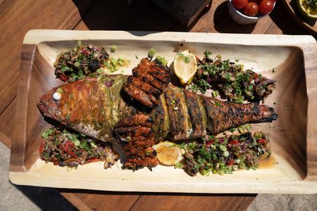 Puerto Rico - Whole queen snapper grilled with fresh vegetables. (Credit: National Geographic/Justin Mandel)