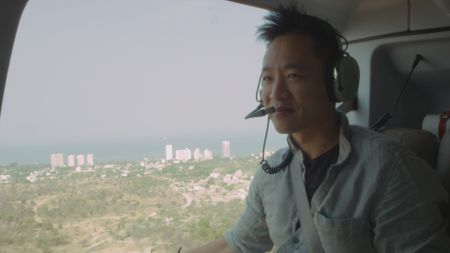 Albert Lin travelling on a helicopter to the jungles. (National Geographic)