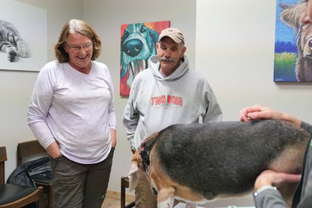Owners Kathy and Tom Schwader receive good news about Lilly, their 10 year old beagle. (National Geographic)