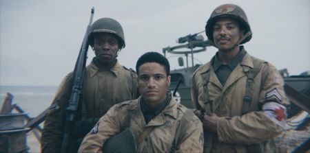Private Henry Parham, Corporal William Dabney and Combat Medic Waverly Woodson (played by Ishmel Bridgeman, Joshua Riley, and Francesco Di Rauso) pose for a group portrait in a scene of a WW2 historic reenactment production for "Erased: WW2's Heroes of Color."  (National Geographic)