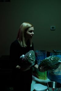 Mariana van Zeller holding bags of weed. (Credit: National Geographic)