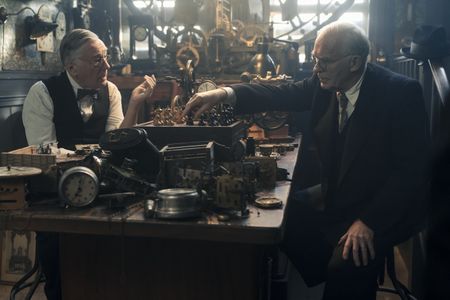 A SMALL LIGHT - Nels, played by Jeffrey Rawle, and Kleiman, played by Ian McElhinney, play a game of chess as seen in A SMALL LIGHT. (Credit: National Geographic for Disney/Dusan Martincek)