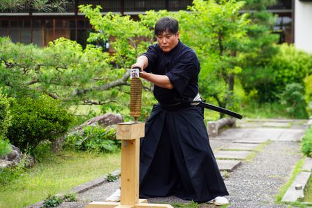 Isao Machii slices through a tatami mat with a katana. (National Geographic/Dana Hayes)