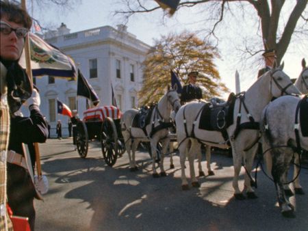 A horse-drawn caisson bearing President John F. Kennedy's body departs the White House towards the U.S. Capitol, where the President will lie in state, Nov. 24, 1963, in Washington, D.C. (John F. Kennedy Presidential Library and Museum, Boston)