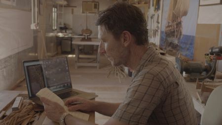 Maritime archaeologist Alessandro Ghidoni examines data in Qantab, Oman. (Windfall Films)