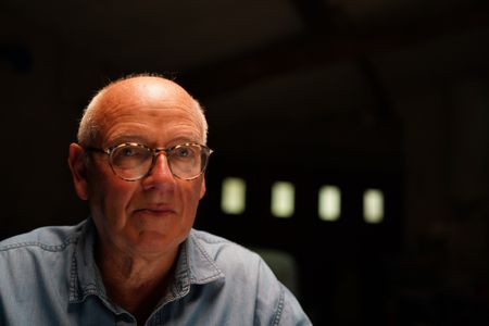 Stéphane Bourgoin is a French author and renowned specialist on serial killers, who since 2019 has been at the center of an internet-led controversy spearheaded by a group of anonymous true crime fans.  Here, Bourgoin poses for a portrait during the production of "Killer Lies: Chasing a True Crime Con Man," a documentary series about obsession and deception, following the unraveling of Stephane Bourgoin’s career as a best-selling author and serial killer expert. (National Geographic/Ben Selkow)