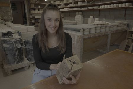 Expert in cuneiform archaeology Lara Bampfield holds a replica of the King's List found in southern Mesopotamia. (Windfall Films)