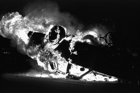 A LAPD car is overturn and set ablaze near the LAPD headquarters, in downtown Los Angeles. Los Angeles has undergone several days of rioting due to the acquittal of the LAPD officers who beat Rodney King. Hundreds of businesses were burned to the ground and over 55 people have been killed. (Photo by Ted Soqui/Corbis via Getty Images)