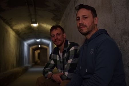 Arthur Williams and Silvia Villarnelll sat across from each other in tunnels underneath Almeria called the "Refugios" in Spain. (National Geographic/Ciaran Henry)