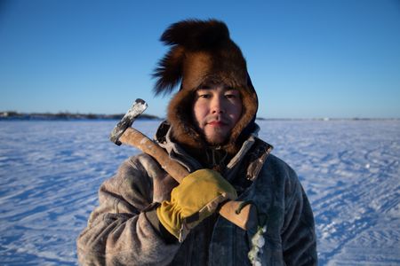 Gage Hoffman setting fish nets under the ice with his brother for subsistence food during the winter season. (BBC Studios Reality Productions, LLC/Isaiah Branch - Boyle)