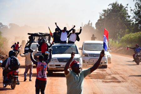 Bobi Wine and his supporters drive through at breakneck speed in Masindi District, Western Uganda after successfully evading a blockade erected by Ugandan security forces to prevent them from reaching their next campaign venue on  November 26, 2020.  (photo credit: Lookman Kampala)
