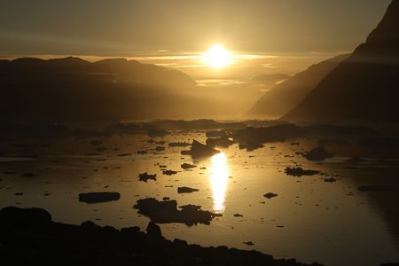 Evening sun over the Fjord, near Ingmikotilaq. (photo credit: National Geographic/Richard Ladkani)