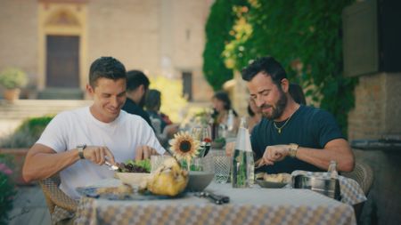 Antoni Porowski and Justin Theroux eating guinea fowl at Locanda del Falco. (National Geographic)