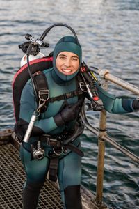 Storyteller and cephalopod expert, Dr Alex Schnell in full SCUBA gear, preparing to dive with octopus in Port Phillip Bay. (photo credit: National Geographic/Harriet Spark)