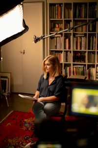 In this behind-the-scenes photo, The New Yorker staff writer Lauren Collins prepares for an interview for "Killer Lies: Chasing a True Crime Con Man," a documentary series about obsession and deception, following the unraveling of Stephane Bourgoin’s career as a best-selling author and serial killer expert. (National Geographic/William Rouse)