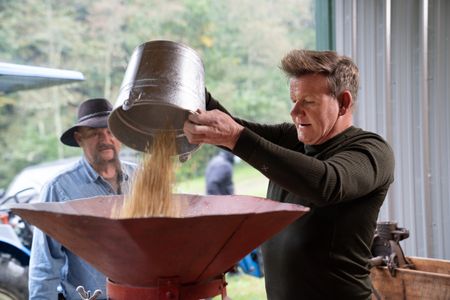 NC - Derek (background) teaches Gordon Ramsay how to make corn whiskey the old fashioned way using a family recipe in the Smoky Mountains of North Carolina. (Credit: National Geographic/Justin Mandel)