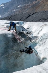 Joseph Fiennes gets a hand while climbing at the Athabasca Glacier.   Sir Ranulph Fiennes, "the greatest living explorer," and his cousin, actor Joseph Fiennes, revisit Ran’s 1971 expedition of Canada’s British Columbia.