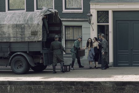 A SMALL LIGHT - The Frank family is forcibly removed from the annex by German soldiers as seen in A SMALL LIGHT. (Credit: National Geographic for Disney/Dusan Martincek)