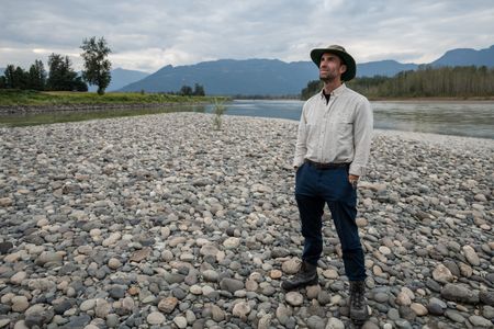 Joseph Fiennes stands near the Fraser River. Sir Ranulph Fiennes, "the greatest living explorer," and his cousin, actor Joseph Fiennes, revisit Ran’s 1971 expedition of Canada’s British Columbia.