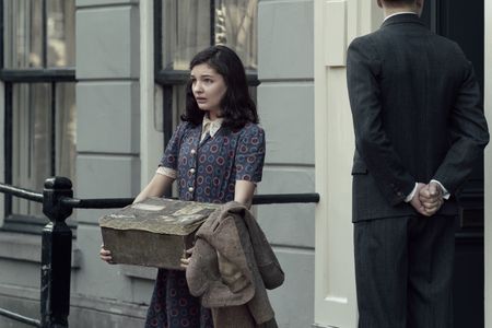 A SMALL LIGHT - Anne Frank, played by Billie Boullet, walks out of the annex as seen in A SMALL LIGHT. (Credit: National Geographic for Disney/Dusan Martincek)