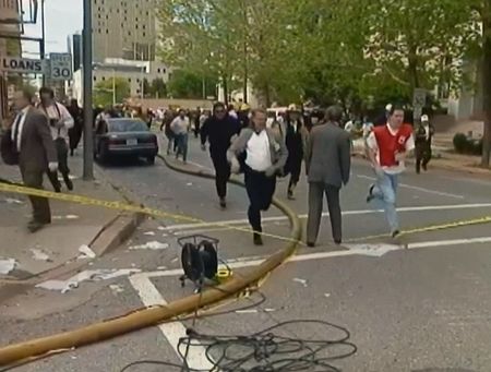 Panicked onlookers, survivors and first responders clear the area at the threat of a possible second explosive device in the Alfred P. Murrah Federal Building on April 19, 1995, in Oklahoma City, Okla. (News9 Oklahoma City)