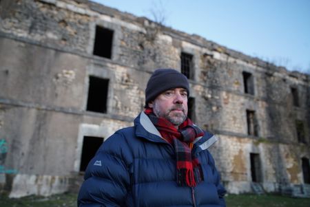 Tony Pollard at Fort Justice, France. Fort Justice was built to protect the nearby citadel of Belfort. The iconic site played a vital role in the Franco-Prussian war. (National Geographic/Ciaran Henry)